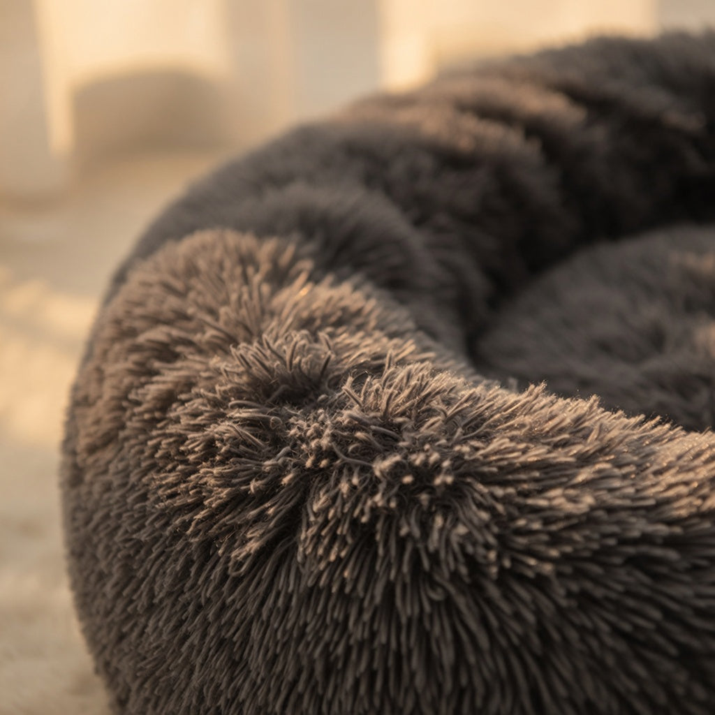 Round donut-style pet bed with raised edges